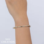 0.56CT 14K Y/G DIAMOND GEO CUT BANGLE