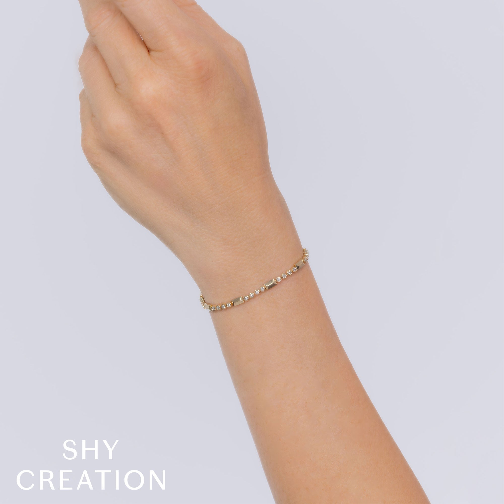 0.54CT 14K Y/G DIAMOND BEZEL GEO CUT BRACELET